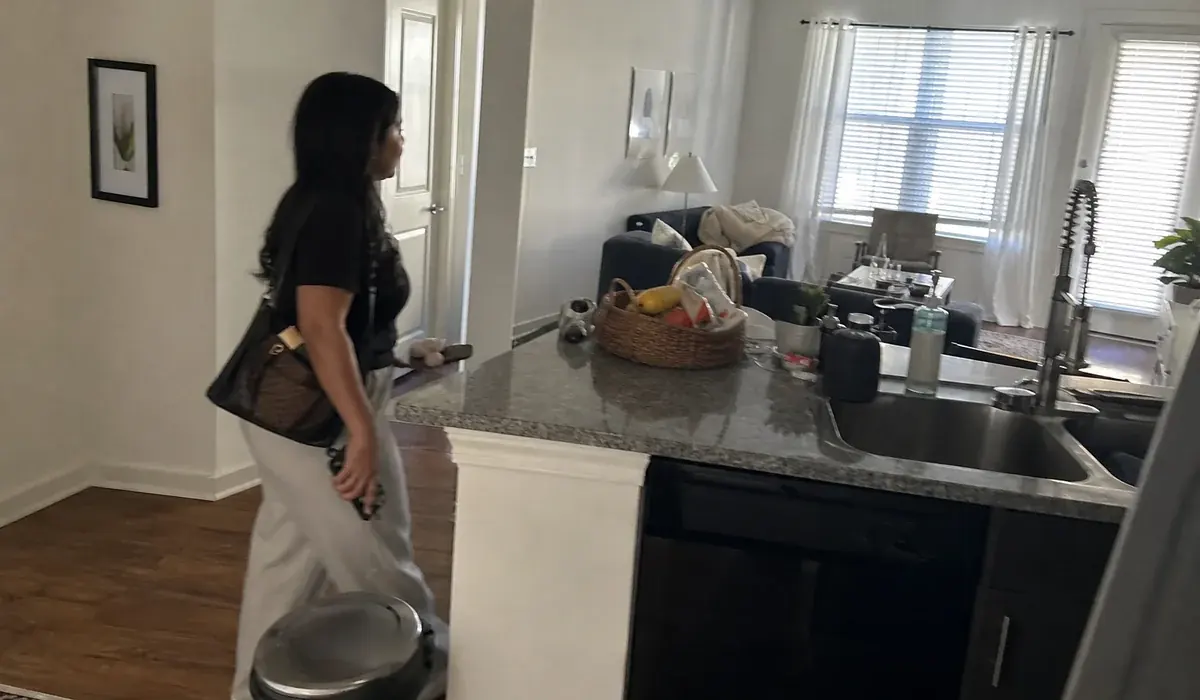 Renter walking through an apartment kitchen on a tour